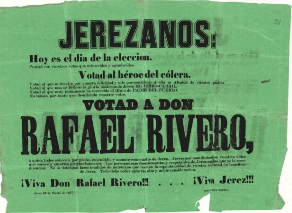 Primer plano de un cartel electoral histórico de 1857 en papel verde donde se lee JEREZANOS y se pide el voto para Rafael Rivero Tixera como alcalde de Jerez, destacando sus logros como el ferrocarril y su labor frente a la epidemia de cólera.