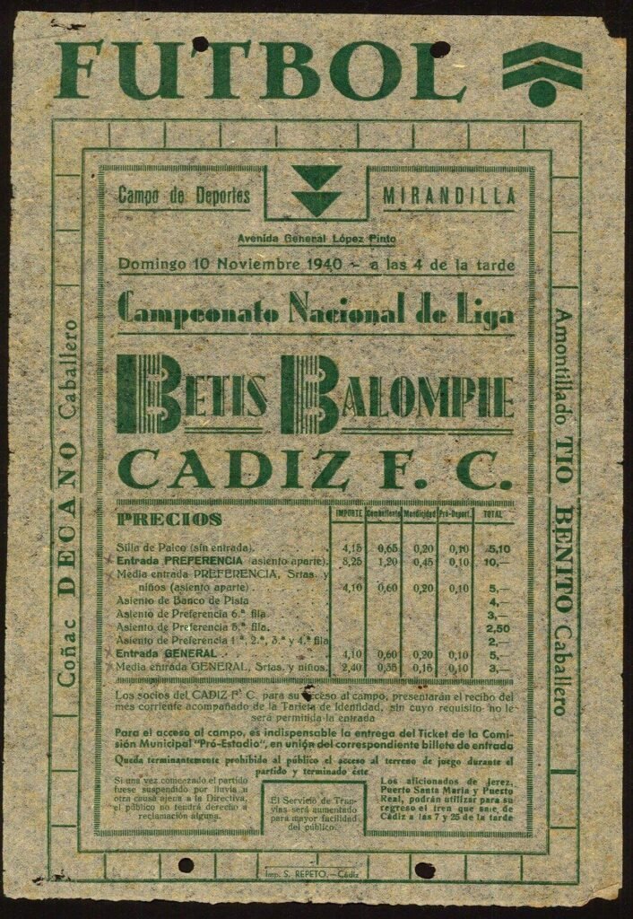 Cartel publicitario oficial e informativo del partido de fútbol Betis contra Cádiz 1940, impreso en tinta verde sobre papel antiguo, detallando precios de entradas, publicidad de licores y horarios de trenes especiales.