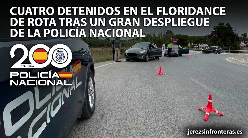 Control policial en carretera de la Policía Nacional con vehículo oficial en primer plano y agentes inspeccionando turismos.