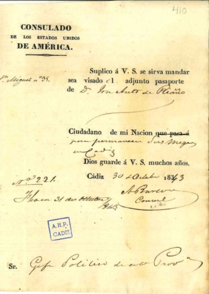 Documento oficial con el encabezado impreso en letras capitales "CONSULADO DE LOS ESTADOS UNIDOS DE AMÉRICA.", texto manuscrito rellenado con tinta oscura, firma del cónsul, el número 410 en la esquina superior derecha y el sello azul rectangular del Archivo Histórico Provincial de Cádiz abajo a la izquierda.
