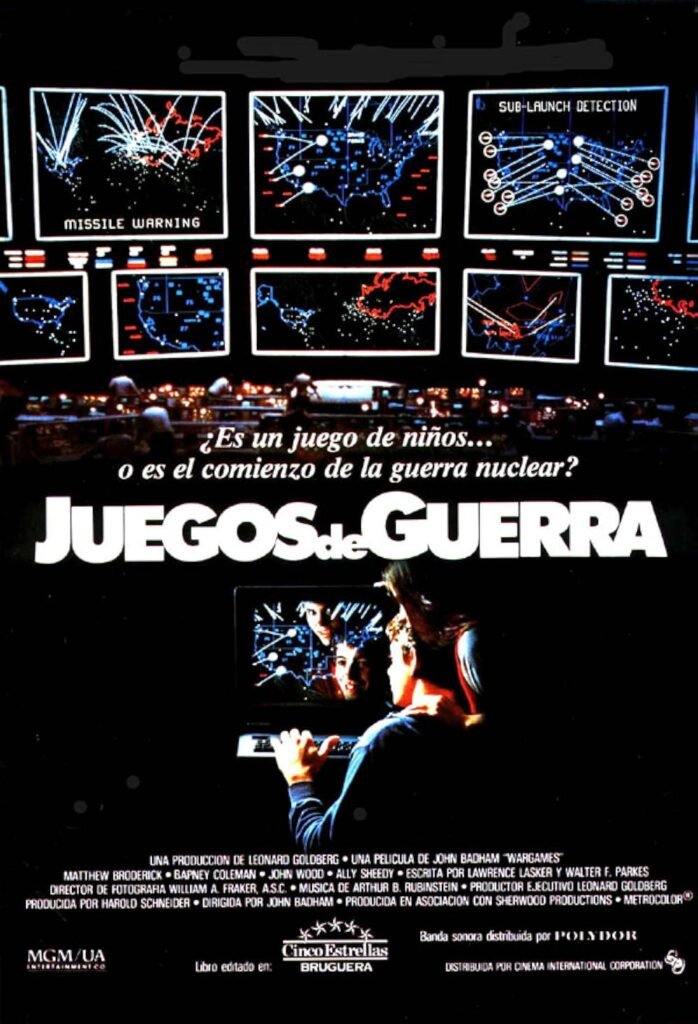Póster original en español de la película 'Juegos de guerra' (1983), mostrando a los protagonistas frente a un ordenador y, sobre ellos, pantallas de control militar con gráficos de alerta de misiles nucleares.